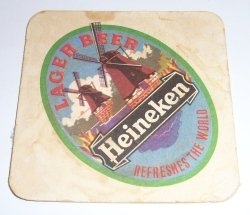 Heineken Beer Coaster 1970's (3¾"w) Here's a vintage drink coaster for your foreign collection from Heineken Lager. This London issue is part of a series highlighting Heineken Brewery locations around the world. Well-used condition. 1 available. Check our other bar items.